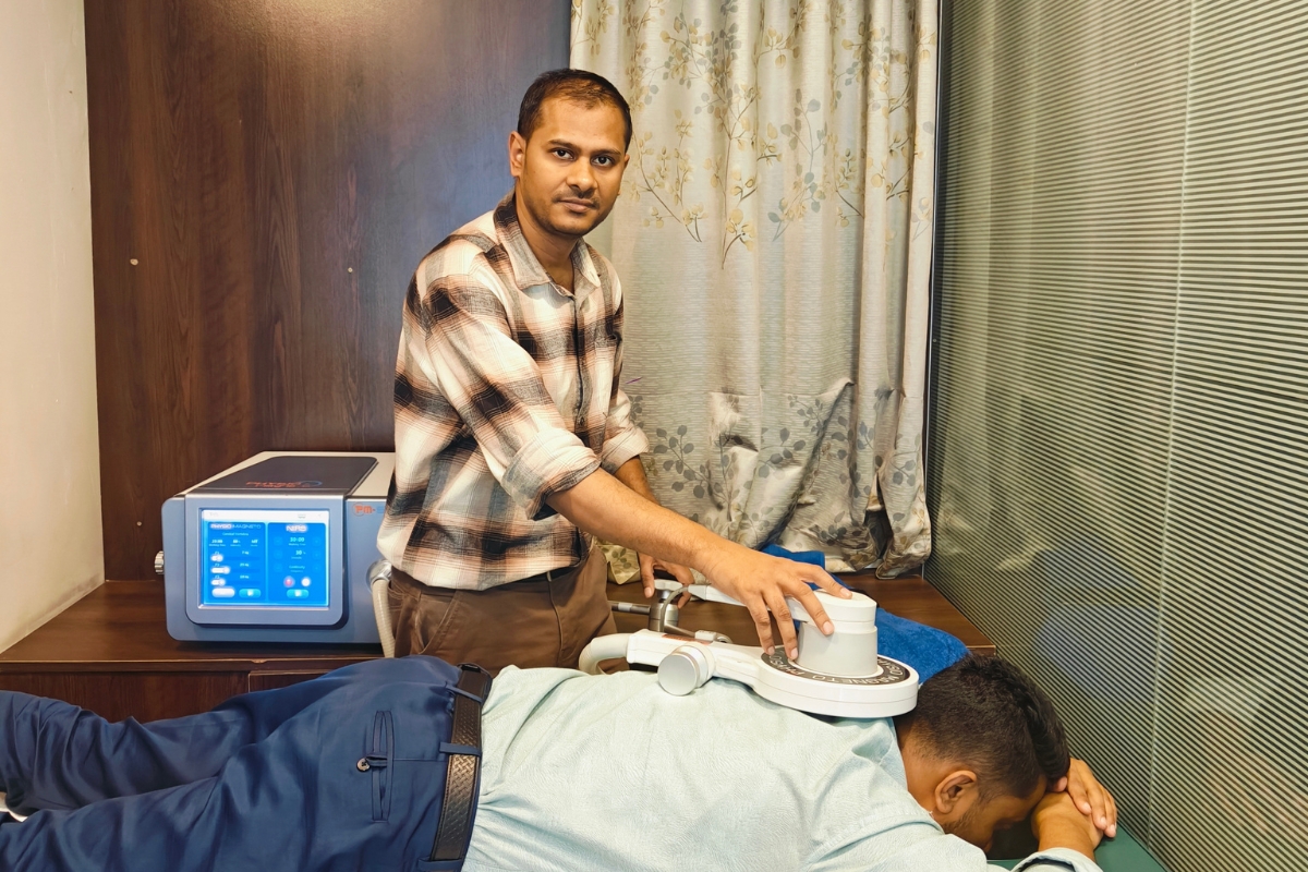 Dr. Sourav Rahman Neck Pain PEMF therapy.jpg
